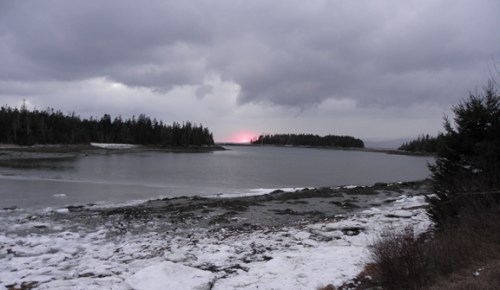 setting sun in grey sky